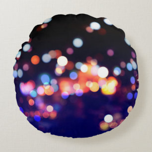 Cojín Redondo Hermosa luz nocturna de ciudad, borrón abstracto