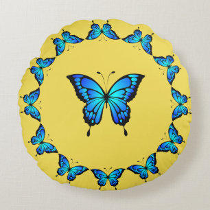 Cojín Redondo Mariposas azules de un comerciante.
