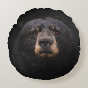 COJÍN REDONDO OSO NEGRO EN LA RAMA DE ÁRBOLES DE MADERA MARRÓN