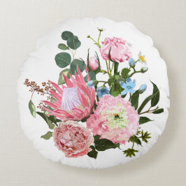 Cojín Redondo Ramo tropical con flores rosas.