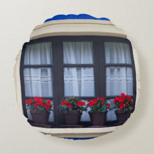 Cojín Redondo Viviendas con flores en ventanas