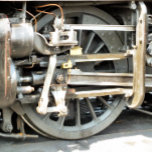 COLLAR DE PLATA DE LEY TRENES DE VAPOR<br><div class="desc">Diseño fotográfico de la rueda desde un tren de vapor.</div>