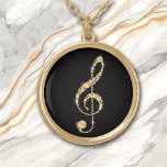 Collar Dorado Faux Amber Diamond Treble Clef on Black Music<br><div class="desc">Increíblemente bello es este collar que presenta un falso diamante de color ámbar dorado formado por un trébol. La imagen se coloca sobre un fondo negro para un efecto dramático, pero puede cambiar fácilmente el color de fondo personalizándolo. ¡Perfecto para el estudiante de música, profesor o intérprete! *Crédito de diseño...</div>