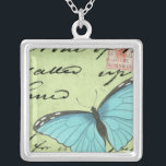 Collar Plateado Mariposa de ala azul en postal Verde azulada<br><div class="desc">Esta postal verde azulada lleva un mensaje de belleza. Una delicada mariposa de ala azul descansa sobre la tarjeta,  oscureciendo parte del guión que contiene. Esta impresión de Vision Studio le haría una gran adición a su hogar!</div>