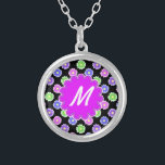 Collar Plateado Monograma del patrón de flor retro colorido<br><div class="desc">El diseño de esta bonito, de tono jovial, es luminoso y colorido, con tonos rosas, violetas, azules y verdes sobre un fondo negro. Tiene un espacio en forma de flor en orquídea - morado donde puedes añadir tu monograma / inicial en blanco para personalizar. Es un diseño un poco retro,...</div>