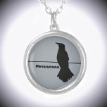 Collar Plateado Personalizable Black Raven Silhouette<br><div class="desc">Este espectacular collar gris y negro de pendant muestra la silueta de un solitario Raven encaramado en un cable contra un cielo gris. Cita The Raven Nevermore, pero se puede personalizar con un Nombre. A lo largo de la historia y las culturas del mundo, el cuervo se encuentra en la...</div>