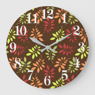 Coloridas hojas de otoño en cálidos tonos de reloj