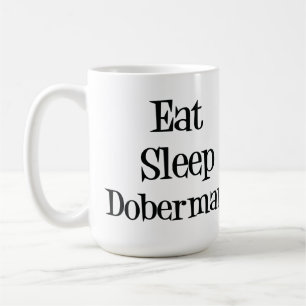 Coma la taza del Doberman del sueño
