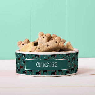 Comedero Dobermanes rojos y negros en el patrón invernal de