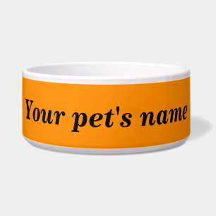 Comedero El nombre de tu mascota con fondo naranja en el ta