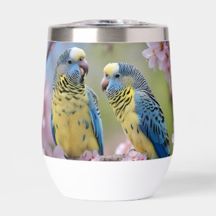 "Compañeros vibrantes: Budgies azules y amarillos"