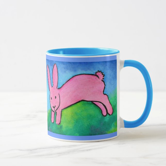 Conejito rosado con la taza azul de la manija (Derecha)
