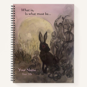 Conejo negro de un cuaderno de bocetos de espiral 