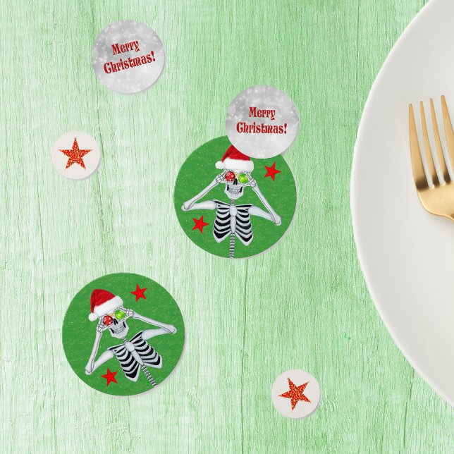 Confeti Festividades Navidades con un divertido esqueleto  (Fun skeletons ornament eyes red and gold stars on Merry Christmas table confetti.)
