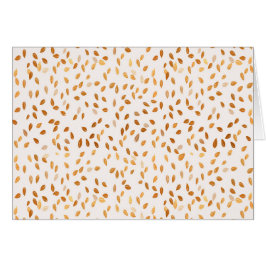 Confetti de hojas de oro sobre fondo rosado