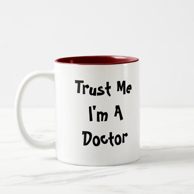 Confíe en que yo es una taza del médico (Izquierda)