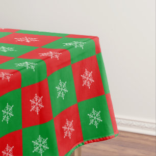 Copos de Navidad en mantel rojo y verde