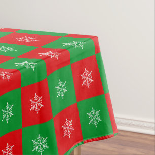 Copos de Navidad sobre mantel rojo y verde
