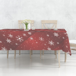 Copos de nieve blancos con manteles de fondo rojo