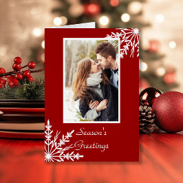 Copos de nieve blancos en los saludos de la tempor