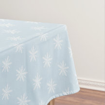 Copos de nieve blancos en mantel azul de Navidad