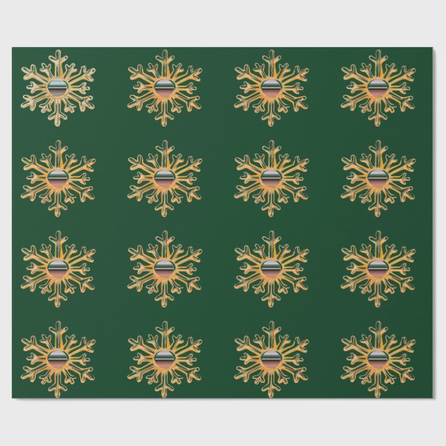 Copos de nieve de oro sobre papel verde (Superficie plana)