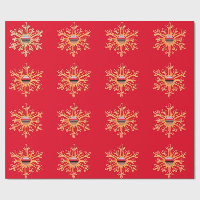 Copos de nieve dorados sobre papel envuelto en roj (Superficie plana)