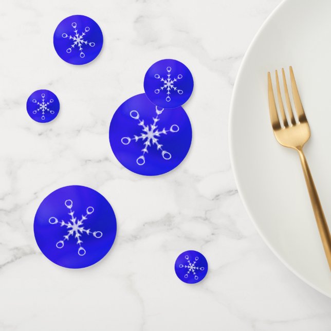 Copos de nieve elegantes sobre confeti de mesa azu (Grupo)
