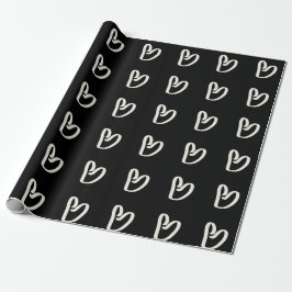 Corazón blanco sobre papel de envoltura negro