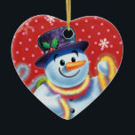Corazón de la decoración de los árboles de Navidad<br><div class="desc">La forma del corazón pega la decoración del árbol de Navidad Snowman y tinsel.pinks. Este jovial muñeco de nieve está a punto de decorar su árbol con coloridos mejillones. Vea los otros personajes de esta misma serie,  Santa y Polar Bear y Rudolph.</div>