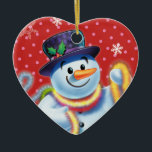 Corazón de la decoración de los árboles de Navidad<br><div class="desc">La forma del corazón pega la decoración del árbol de Navidad Snowman y tinsel.pinks. Este jovial muñeco de nieve está a punto de decorar su árbol con coloridos mejillones. Vea los otros personajes de esta misma serie,  Santa y Polar Bear y Rudolph.</div>