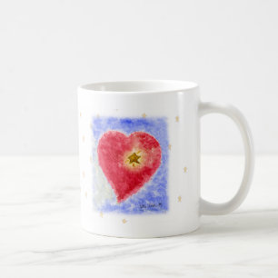 Corazón en la taza blanca