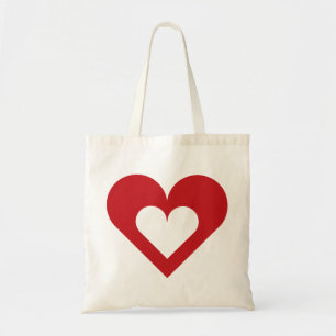 Corazón rojo en la bolsa de la dedo del corazón