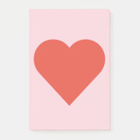 Corazón rojo en nota de post-it rosada del fondo
