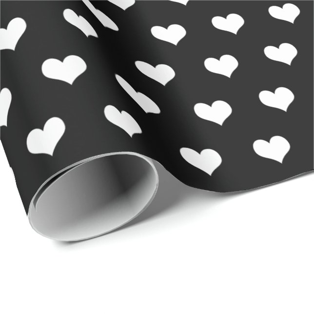 corazones blancos sobre papel de envoltura negro (Esquina del rollo)