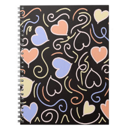 Corazones de color claro sobre una libreta de fond