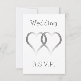 Corazones plateados con tarjeta RSVP de boda