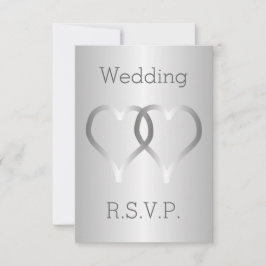 Corazones plateados con tarjeta RSVP de boda