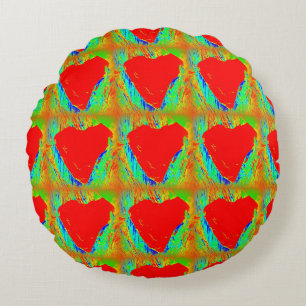 corazones rojos en la almohada verde de lanzamient