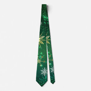 Corbata Copo de nieve dorado de Navidad sobre fondo verde