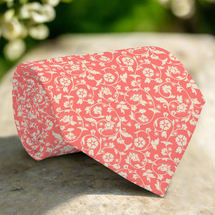 Corbata Flores y hojas sobre fondo rojo claro