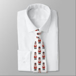 Corbata Navidades Nutcracker<br><div class="desc">Un divertido patrón de petardos Navidades rojos,  negros y blancos decora esta corbata. Diversión para la temporada de vacaciones. Diseñado para ti por Blackberry Boulevard.</div>