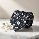 Corbata Navy Floral<br><div class="desc">Elevate your style with poetic elegance using this breathtaking midnight navy necktie blooming with delicate florals! A graceful pattern of petite white blossoms, shimmering gold and beige foliage, slender stems, tiny leaves, and airy botanical sprigs creates a luxurious, vintage-inspired meadow scene against a deep, rich navy background. This sophisticated yet...</div>