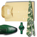 Corbata Patrón de Monstera Verde Hawái<br><div class="desc">La corbata masculina de la prensa hawaiana presenta un diseño cautivador con exuberantes hojas tropicales verdes enmarcadas en un llamativo fondo negro. Los colores contrastantes crean un efecto atrevido y visualmente llamativo, haciendo de esta corbata un accesorio destacado para cualquier ocasión. La profunda sombra del negro proporciona un telón de...</div>