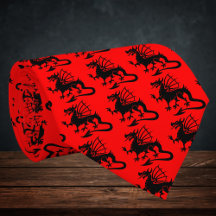 Silueta de dragón galés negro con fondo rojo