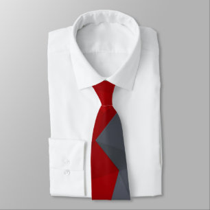 Corbata Triángulos grises y rojos dispuestos al azar.