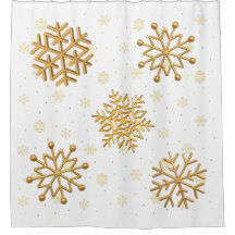 Copos de nieve metálicos de oro sobre blanco