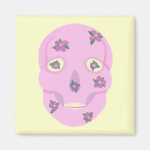 Cráneo de azúcar rosa con imanes de flores moradas