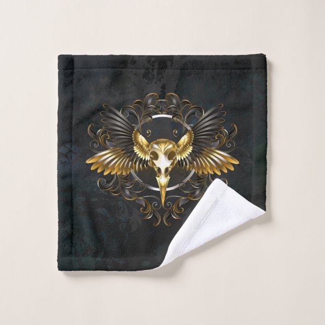 Cráneo de pájaro dorado sobre fondo negro (Toallita)