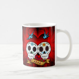 Cráneos del amor con la taza de los Bluebirds